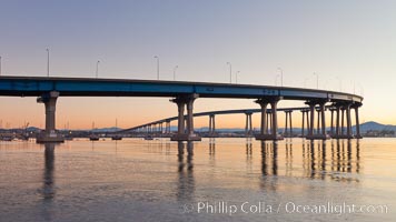 Coronado Bridge, linking San Diego to Coronado, sunrise, viewed from Coronado Island. San Diego Coronado Bridge, known locally as the Coronado Bridge, links San Diego with Coronado, California. The bridge was completed in 1969 and was a toll bridge until 2002. It is 2.1 miles long and reaches a height of 200 feet above San Diego Bay.