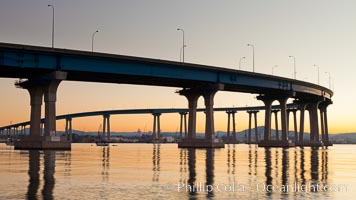 Coronado Bridge, linking San Diego to Coronado, sunrise, viewed from Coronado Island. San Diego Coronado Bridge, known locally as the Coronado Bridge, links San Diego with Coronado, California. The bridge was completed in 1969 and was a toll bridge until 2002. It is 2.1 miles long and reaches a height of 200 feet above San Diego Bay.