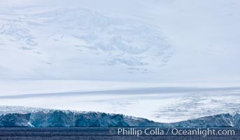 Coronation Island, is the largest of the South Orkney Islands, reaching 4,153' (1,266m) above sea level.  While it is largely covered by ice, Coronation Island also is home to some tundra habitat, and is inhabited by many seals, penguins and seabirds