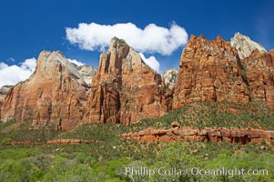 Court of the Patriarchs, a series of red sandstone peaks, rise above Zion Canyon.
