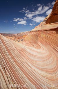 The Wave, an area of fantastic eroded sandstone featuring beautiful swirls, wild colors, countless striations, and bizarre shapes set amidst the dramatic surrounding North Coyote Buttes of Arizona and Utah.  The sandstone formations of the North Coyote Buttes, including the Wave, date from the Jurassic period. Managed by the Bureau of Land Management, the Wave is located in the Paria Canyon-Vermilion Cliffs Wilderness and is accessible on foot by permit only
