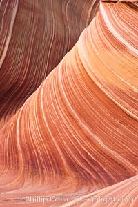 The Wave, an area of fantastic eroded sandstone featuring beautiful swirls, wild colors, countless striations, and bizarre shapes set amidst the dramatic surrounding North Coyote Buttes of Arizona and Utah.  The sandstone formations of the North Coyote Buttes, including the Wave, date from the Jurassic period. Managed by the Bureau of Land Management, the Wave is located in the Paria Canyon-Vermilion Cliffs Wilderness and is accessible on foot by permit only