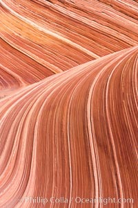 The Wave, an area of fantastic eroded sandstone featuring beautiful swirls, wild colors, countless striations, and bizarre shapes set amidst the dramatic surrounding North Coyote Buttes of Arizona and Utah.  The sandstone formations of the North Coyote Buttes, including the Wave, date from the Jurassic period. Managed by the Bureau of Land Management, the Wave is located in the Paria Canyon-Vermilion Cliffs Wilderness and is accessible on foot by permit only