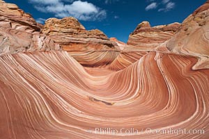 The Wave, an area of fantastic eroded sandstone featuring beautiful swirls, wild colors, countless striations, and bizarre shapes set amidst the dramatic surrounding North Coyote Buttes of Arizona and Utah.  The sandstone formations of the North Coyote Buttes, including the Wave, date from the Jurassic period. Managed by the Bureau of Land Management, the Wave is located in the Paria Canyon-Vermilion Cliffs Wilderness and is accessible on foot by permit only