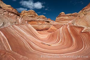 The Wave, an area of fantastic eroded sandstone featuring beautiful swirls, wild colors, countless striations, and bizarre shapes set amidst the dramatic surrounding North Coyote Buttes of Arizona and Utah.  The sandstone formations of the North Coyote Buttes, including the Wave, date from the Jurassic period. Managed by the Bureau of Land Management, the Wave is located in the Paria Canyon-Vermilion Cliffs Wilderness and is accessible on foot by permit only