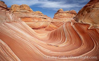 The Wave, an area of fantastic eroded sandstone featuring beautiful swirls, wild colors, countless striations, and bizarre shapes set amidst the dramatic surrounding North Coyote Buttes of Arizona and Utah.  The sandstone formations of the North Coyote Buttes, including the Wave, date from the Jurassic period. Managed by the Bureau of Land Management, the Wave is located in the Paria Canyon-Vermilion Cliffs Wilderness and is accessible on foot by permit only