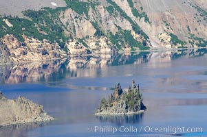 Phantom Ship, Crater Lake. Crater Lake is the six-mile wide lake inside the collapsed caldera of volcanic Mount Mazama, Crater Lake National Park, Oregon