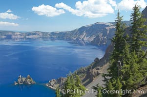 Crater Lake and Phantom Ship. Crater Lake is the six-mile wide lake inside the collapsed caldera of volcanic Mount Mazama, Crater Lake National Park, Oregon
