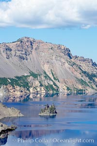 Phantom Ship, Crater Lake. Crater Lake is the six-mile wide lake inside the collapsed caldera of volcanic Mount Mazama, Crater Lake National Park, Oregon