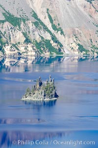 Phantom Ship, Crater Lake. Crater Lake is the six-mile wide lake inside the collapsed caldera of volcanic Mount Mazama, Crater Lake National Park, Oregon