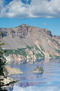 Phantom Ship, Crater Lake. Crater Lake is the six-mile wide lake inside the collapsed caldera of volcanic Mount Mazama, Crater Lake National Park, Oregon