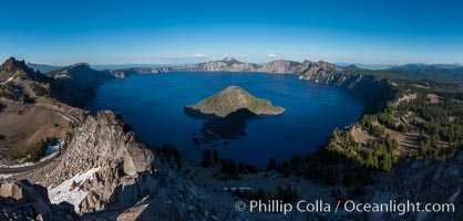 Panorama of Crater Lake from Watchman Lookout Station, panoramic picture. The Watchman Lookout Station No. 168 is one of two fire lookout towers in Crater Lake National Park in southern Oregon. For many years, National Park Service personnel used the lookout to watch for wildfires during the summer months. It is also a popular hiking destination because it offers an excellent view of Crater Lake and the surrounding area