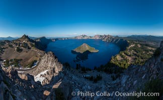 Panorama of Crater Lake from Watchman Lookout Station, panoramic picture. The Watchman Lookout Station No. 168 is one of two fire lookout towers in Crater Lake National Park in southern Oregon. For many years, National Park Service personnel used the lookout to watch for wildfires during the summer months. It is also a popular hiking destination because it offers an excellent view of Crater Lake and the surrounding area