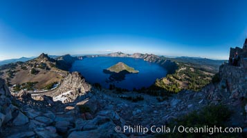 Panorama of Crater Lake from Watchman Lookout Station, panoramic picture. The Watchman Lookout Station No. 168 is one of two fire lookout towers in Crater Lake National Park in southern Oregon. For many years, National Park Service personnel used the lookout to watch for wildfires during the summer months. It is also a popular hiking destination because it offers an excellent view of Crater Lake and the surrounding area