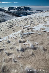 Crested snow patterns along the slopes of Devil Island