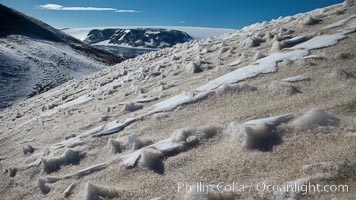 Crested snow patterns along the slopes of Devil Island