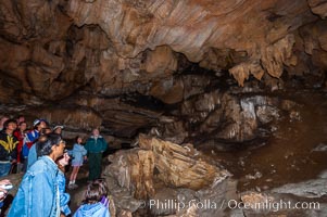 Visitors admire the many stalactites hanging from the ceiling of the Dome Room, Crystal Cave, Sequoia Kings Canyon National Park, California