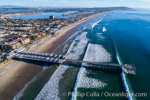 Crystal Pier and Pacific Beach coastline, Mission Bay, Point Loma and San Diego visible in the distance, aerial photo