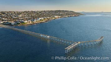 Ocean Beach Pier, also known as the OB Pier or Ocean Beach Municipal Pier, is the longest concrete pier on the West Coast measuring 1971 feet (601 m) long.  Sunset Cliffs and Point Loma extend off to the south, San Diego, California