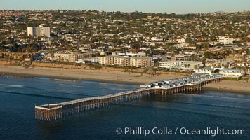 Crystal Pier, 872 feet long and built in 1925, extends out into the Pacific Ocean from the town of Pacific Beach, San Diego, California