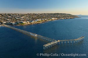 Ocean Beach Pier, also known as the OB Pier or Ocean Beach Municipal Pier, is the longest concrete pier on the West Coast measuring 1971 feet (601 m) long.  Sunset Cliffs and Point Loma extend off to the south.