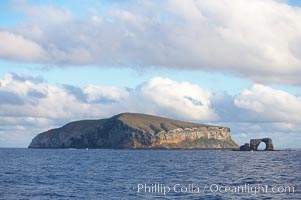 Darwin Island, with Darwins Arch on the right.  Darwin Island is the northernmost of the Galapagos Islands and is home to enormous numbers of seabirds