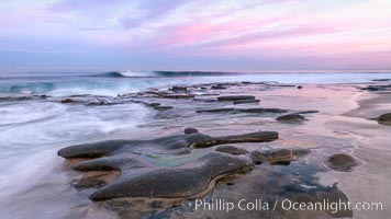 Dawn over La Jolla wave, reef and rocky coastline