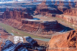 Dead Horse Point Overlook, with the Colorado River flowing 2,000 feet below.  300 million years of erosion has carved the expansive canyons, cliffs and walls below and surrounding Deadhorse Point.