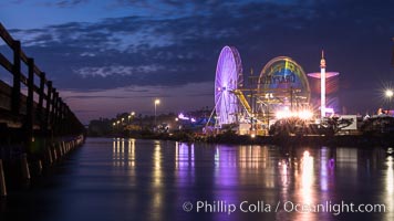 Del Mar Fair and San Dieguito Lagoon at Night.  Lights from the San Diego Fair reflect in San Dieguito Lagooon, with the train track trestles to the left