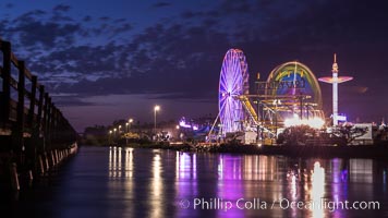 Del Mar Fair and San Dieguito Lagoon at Night.  Lights from the San Diego Fair reflect in San Dieguito Lagooon, with the train track trestles to the left