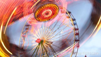 Ferris wheel and fair rides at sunset, blurring due to long exposure, Del Mar Fair