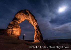 Delicate Arch with Stars and Moon, at night, Arches National Park (Note: this image was created before a ban on light-painting in Arches National Park was put into effect.  Light-painting is no longer permitted in Arches National Park)