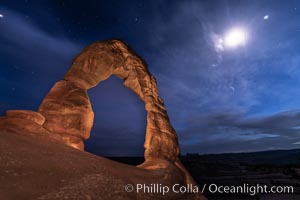 Delicate Arch with Stars and Moon, at night, Arches National Park (Note: this image was created before a ban on light-painting in Arches National Park was put into effect.  Light-painting is no longer permitted in Arches National Park)