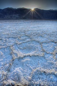 Devils Golf Course. Evaporated salt has formed into gnarled, complex crystalline shapes on the salt pan of Death Valley National Park, one of the largest salt pans in the world.  The shapes are constantly evolving as occasional floods submerge the salt concretions before receding and depositing more salt.