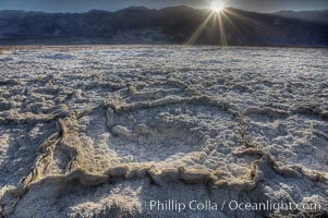 Devils Golf Course. Evaporated salt has formed into gnarled, complex crystalline shapes on the salt pan of Death Valley National Park, one of the largest salt pans in the world.  The shapes are constantly evolving as occasional floods submerge the salt concretions before receding and depositing more salt