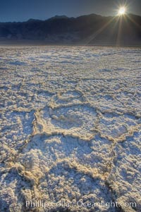 Devils Golf Course. Evaporated salt has formed into gnarled, complex crystalline shapes on the salt pan of Death Valley National Park, one of the largest salt pans in the world.  The shapes are constantly evolving as occasional floods submerge the salt concretions before receding and depositing more salt