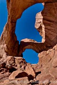 Double Arch, an amazing pair of natural arches formed in the red Entrada sandstone of Arches National Park. Utah, USA, natural history stock photograph, photo id 18180