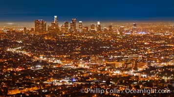 Downtown Los Angeles at night, street lights, buildings light up the night.