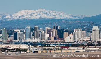 Downtown San Diego with snow-covered Mount Laguna in the distance