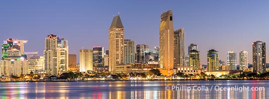 Downtown San Diego Skyline and Waterfront at Sunrise.  Panoramic photo of San Diego embarcadero, showing the San Diego Marriott Hotel and Marina (center) and Manchester Grand Hyatt Hotel (left)