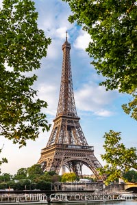 La Tour Eiffel. The Eiffel Tower is an iron lattice tower located on the Champ de Mars in Paris, named after the engineer Gustave Eiffel, who designed the tower in 1889 as the entrance arch to the 1889 World's Fair. The Eiffel tower is the tallest structure in Paris and the most-visited paid monument in the world