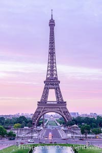 La Tour Eiffel. The Eiffel Tower is an iron lattice tower located on the Champ de Mars in Paris, named after the engineer Gustave Eiffel, who designed the tower in 1889 as the entrance arch to the 1889 World's Fair. The Eiffel tower is the tallest structure in Paris and the most-visited paid monument in the world