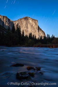 El Capitan and star trails, at night, illuminated by the light of the full moon, Yosemite National Park, California
