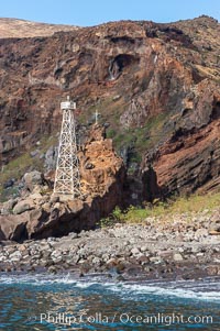 Lighthouse and cross mark the site of a small fishing shack and old chapel and prison near the north end of Guadalupe Island (Isla Guadalupe)