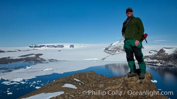 Enjoying a sunny warm day on the summit of Devil Island, with the cliffs of Vega Island in the distance