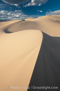 Eureka Dunes.  The Eureka Valley Sand Dunes are California's tallest sand dunes, and one of the tallest in the United States.  Rising 680' above the floor of the Eureka Valley, the Eureka sand dunes are home to several endangered species, as well as "singing sand" that makes strange sounds when it shifts.  Located in the remote northern portion of Death Valley National Park, the Eureka Dunes see very few visitors