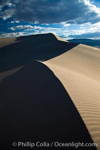 Eureka Dunes. The Eureka Valley Sand Dunes are California's tallest sand dunes, and one of the tallest in the United States. Rising 680' above the floor of the Eureka Valley, the Eureka sand dunes are home to several endangered species, as well as "singing sand" that makes strange sounds when it shifts. Located in the remote northern portion of Death Valley National Park, the Eureka Dunes see very few visitors