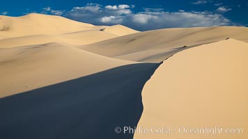 Eureka Dunes.  The Eureka Valley Sand Dunes are California's tallest sand dunes, and one of the tallest in the United States.  Rising 680' above the floor of the Eureka Valley, the Eureka sand dunes are home to several endangered species, as well as "singing sand" that makes strange sounds when it shifts.  Located in the remote northern portion of Death Valley National Park, the Eureka Dunes see very few visitors