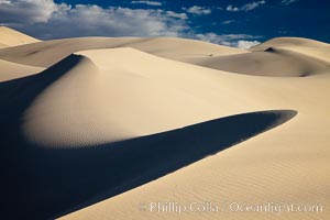 Eureka Dunes.  The Eureka Valley Sand Dunes are California's tallest sand dunes, and one of the tallest in the United States.  Rising 680' above the floor of the Eureka Valley, the Eureka sand dunes are home to several endangered species, as well as "singing sand" that makes strange sounds when it shifts.  Located in the remote northern portion of Death Valley National Park, the Eureka Dunes see very few visitors