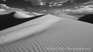Eureka Sand Dunes, infrared black and white.  The Eureka Dunes are California's tallest sand dunes, and one of the tallest in the United States.  Rising 680' above the floor of the Eureka Valley, the Eureka sand dunes are home to several endangered species, as well as "singing sand" that makes strange sounds when it shifts. Death Valley National Park, USA, natural history stock photograph, photo id 25278